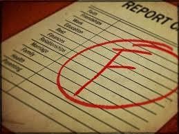 Report card marked with a red F grade