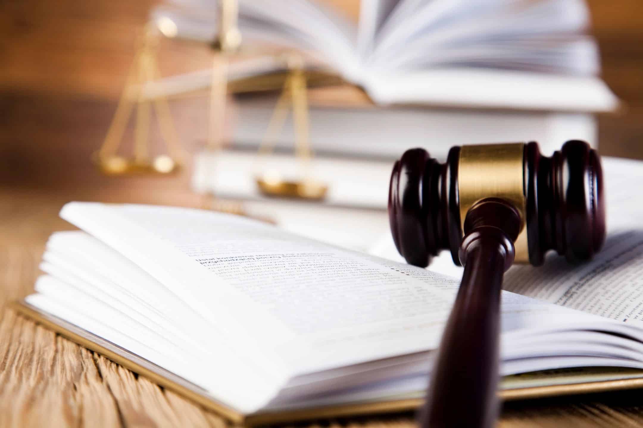 Wooden gavel resting on an open law book, illustrating commercial litigation for business owners
